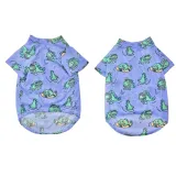 Front and back view of purple dinosaur print dog shirt made from breathable mesh material