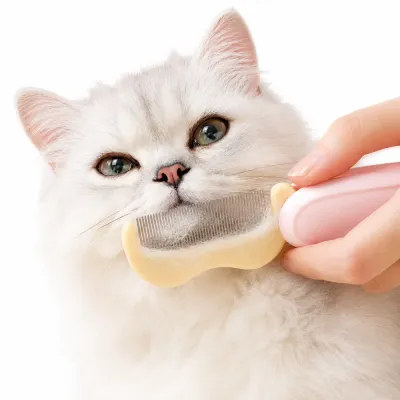 Foldable fine-tooth pet comb removing loose fur from a long-haired cat