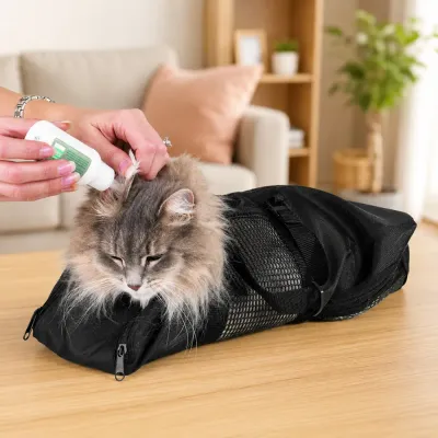 Cat Restraint Bag for Medication and Ear Care Cat restraint grooming bag used for ear cleaning, medication application, and veterinary care