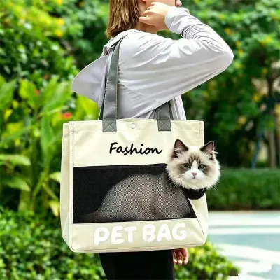 Cat Traveling in Breathable Pet Tote Carrier Outdoors Cat sitting inside a breathable pet tote carrier bag during outdoor travel