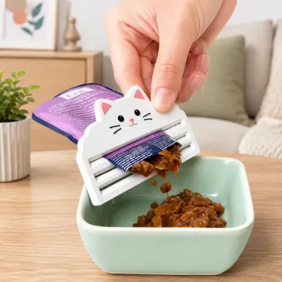 Cat Food Squeezer for Daily Pet Feeding Cat food pouch squeezer being used to dispense wet cat food in a home feeding environment