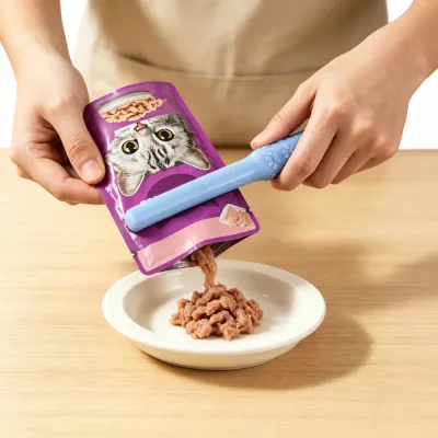 Easy Wet Cat Food Feeding with Cat Food Squeezer Using a cat food pouch squeezer to dispense wet cat food into a bowl quickly and cleanly.