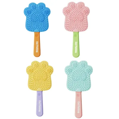 Four-color pet grooming and massage brushes for cats and dogs displayed on white background