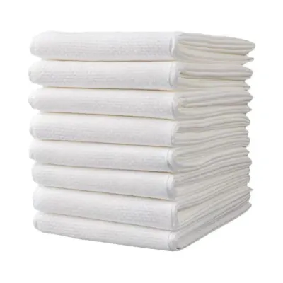 Disposable Dog Bath Towels Bulk Pack for Pet Grooming Stack of white disposable dog bath towels for pet grooming and drying