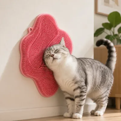 Gray tabby cat rubbing against a wall mounted cat self groomer brush for massage, shedding control and self grooming indoors