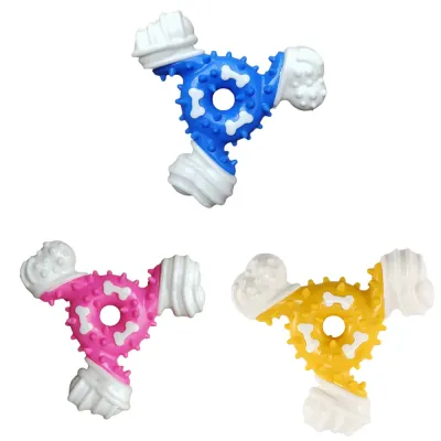 Nylon Rubber Dog Chew Toy Multi Color Options Blue Pink Yellow Three color options of T-shaped nylon rubber dog chew toy in blue pink and yellow isolated on white background