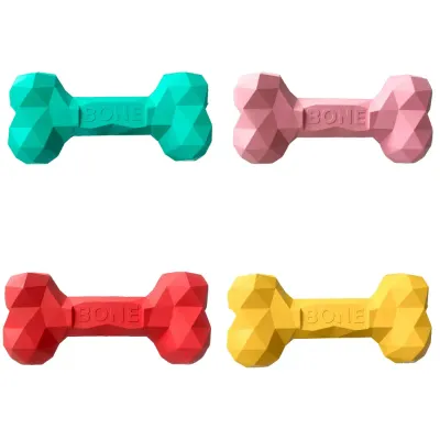 Colorful Dog Treat Dispensing Bone Toys Green, pink, red, and yellow dog treat dispensing bone toys for chewing and interactive play