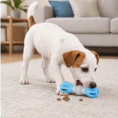 Small dog chewing blue treat dispensing toy indoors with kibble snacks on carpet