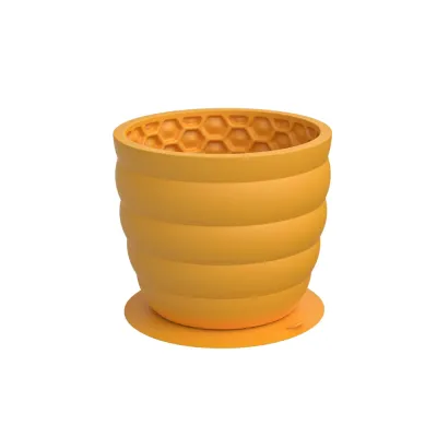 Yellow Honeycomb Silicone Dog Slow Feeder Cup Yellow silicone honeycomb dog slow feeder cup with suction base on white background