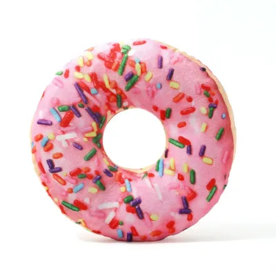 Pink Donut Plush Dog Toy White Background Pink donut plush dog toy with colorful sprinkles on white background