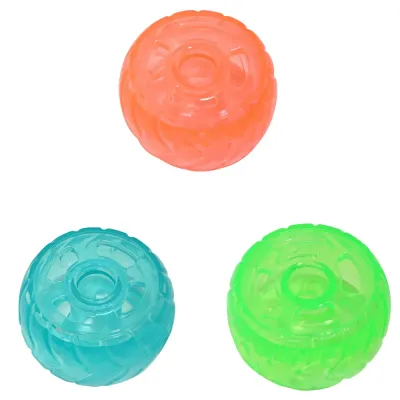 Colorful Dog Treat Dispensing Tire Toys Blue, green, and orange dog treat dispensing tire toys on a white background for wholesale pet stores