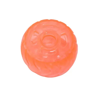 Orange Dog Treat Dispensing Tire Toy Orange translucent dog treat dispensing tire toy on a clean white background