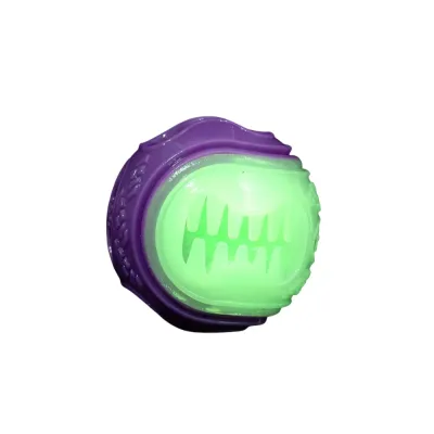 Purple Glow in the Dark Dog Treat Ball Purple glow in the dark dog treat ball on white background