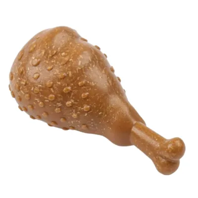 Brown Chicken Drumstick Dog Chew Toy White Background Brown chicken drumstick dog chew toy with textured bumps on white background