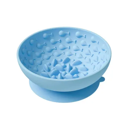 Blue silicone slow feeder dog bowl with raised interior patterns and anti-slip suction base.