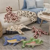Ocean Plush Dog Toy Collection Display Ocean-themed dog plush toys displayed in a coastal living room scene