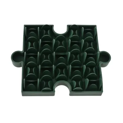 Green puzzle-shaped dog slow feeder bowl on a clean white background.
