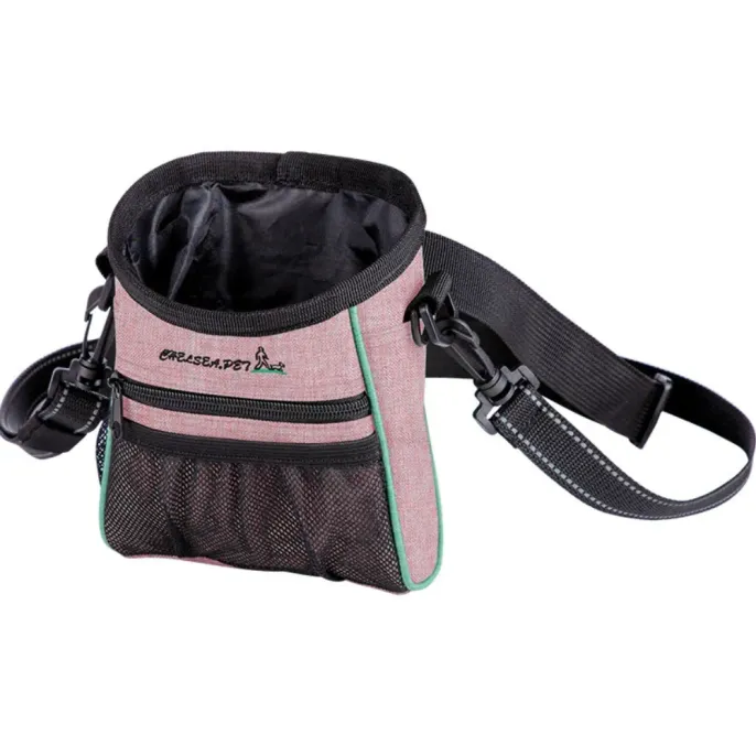 Pink dog training treat pouch with black mesh pocket, open top, and adjustable waist or shoulder strap on white background