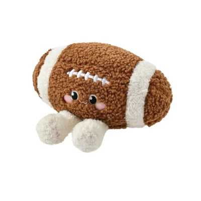 Brown and white American football plush dog toy with cute face and soft plush legs on white background