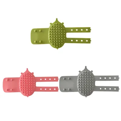 Green pink and grey silicone cat self grooming brushes shown on a clean white background