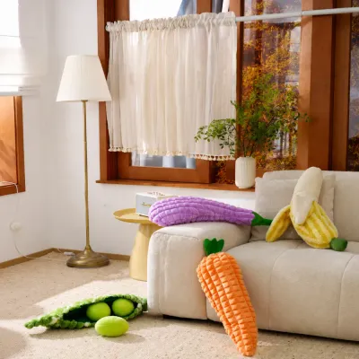 Giant Carrot Dog Toy in Home Play Scene Large carrot plush dog toy placed in living room with other pet toys