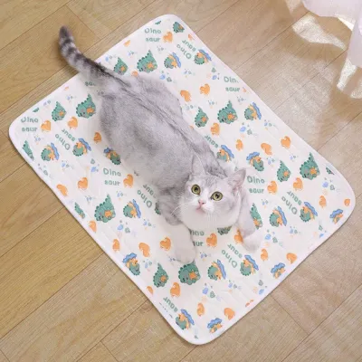 Cat resting comfortably on a breathable ice silk cooling mat indoors.