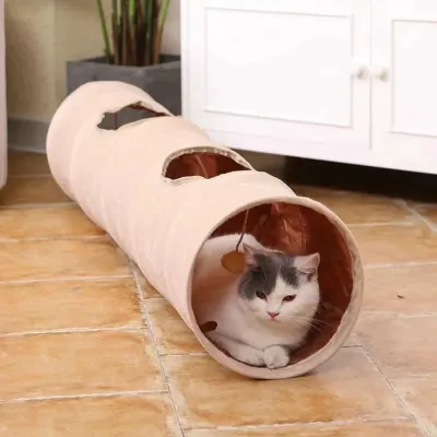 Indoor Cat Resting in Foldable Cat Tunnel White and gray cat resting inside a beige foldable plush tunnel in a home