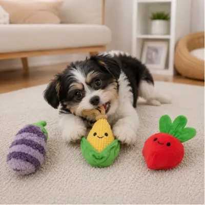 Small Dog Playing with Corn Plush Toy Small dog chewing a corn plush toy beside eggplant and radish dog toys in a living room