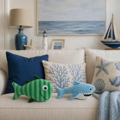 Green fish and blue shark plush dog toys displayed on a coastal-style living room sofa.