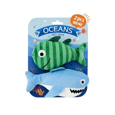 Front view of a wholesale ocean fish plush dog toy set with green fish and blue shark in retail packaging.