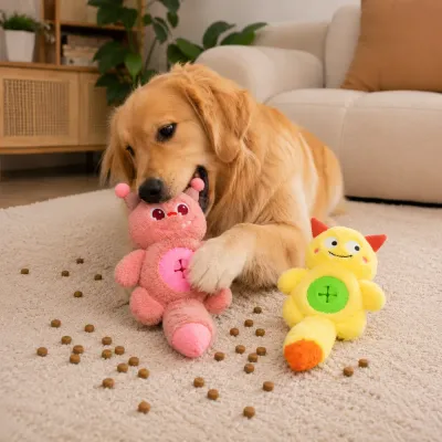 Golden Retriever playing with a pink plush treat dispensing dog toy beside a yellow monster toy