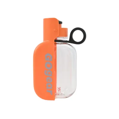 Orange portable dog water bottle with built-in foldable drinking bowl and leak-proof design on white background.