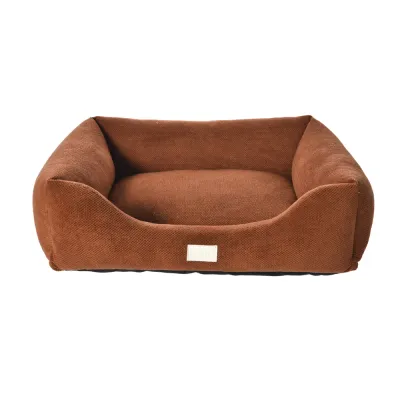 Brown Corduroy Dog Bed – Front View Front view of a brown corduroy dog bed with cushioned interior, raised sides and low entry