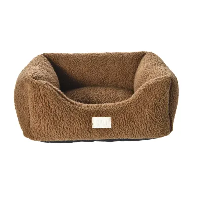 Brown Plush Bolster Dog Bed Front View Front view of a brown plush dog bed with high padded sides, soft sleeping surface and low front opening.