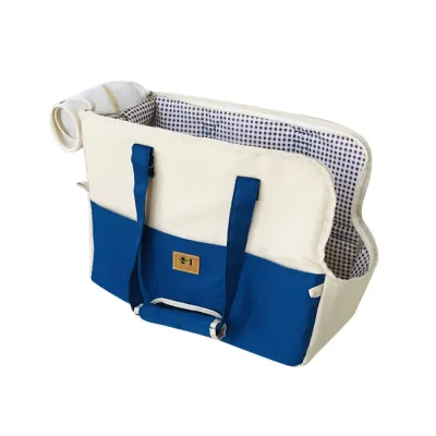 Blue and cream crossbody pet carrier with checkered lining, front pocket and roll-up mesh cover.