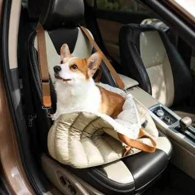 Dog Car Carrier for Safe and Comfortable Travel Corgi sitting in a soft dog car carrier secured on the front passenger seat