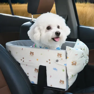 Small Dog Riding in a Car Carrier Bag Small white dog sitting comfortably inside a beige padded dog car carrier bag on a vehicle seat