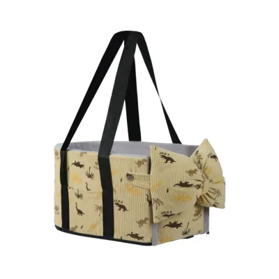Yellow Dog Car Carrier Bag with Bow Pillow Yellow corduroy dog car carrier bag with dinosaur print, black shoulder straps and detachable bow pillow