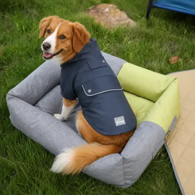 Navy Dog Raincoat for Outdoor Adventures Medium-sized dog wearing a navy water-resistant PU raincoat while sitting outdoors on a pet bed.