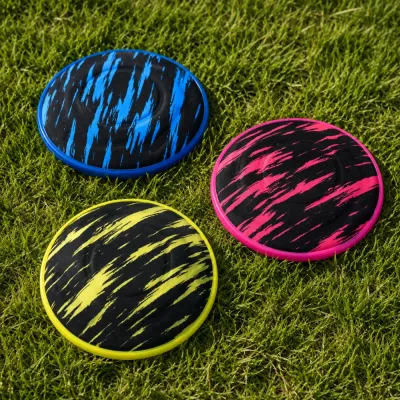 Colorful EVA Dog Flying Discs for Outdoor Play Blue, pink and yellow solid EVA dog flying discs arranged on green grass for outdoor pet play.
