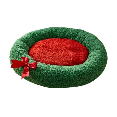 Round Christmas Cat Bed with Red Bow Round Christmas cat bed in green and red with soft raised rim and satin bow