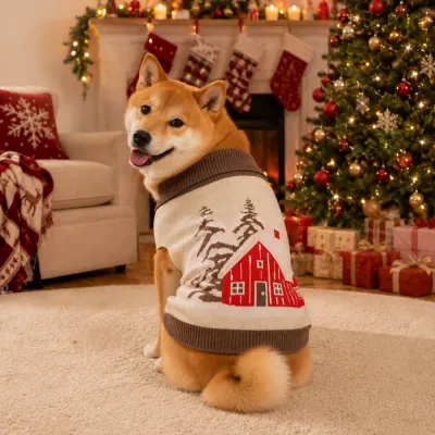 Shiba Inu wearing a beige Christmas dog sweater with a red cabin pattern beside a decorated Christmas tree