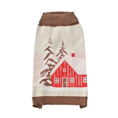 Beige Christmas dog sweater with red cabin and snowy pine tree knit pattern on a white background