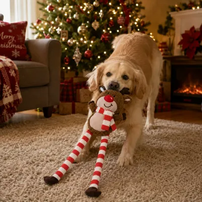 Dog Playing with Christmas Reindeer Plush Toy Golden Retriever playing with long leg Christmas reindeer plush dog toy beside Christmas tree in living room