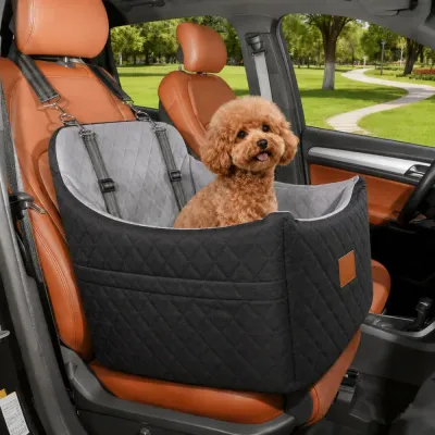 Dog Car Seat Bed for Small Dogs Travel Small dog sitting in a quilted dog car seat bed secured to the passenger seat during car travel