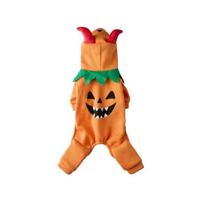 Orange Halloween pumpkin dog costume with monster face and green leaf details