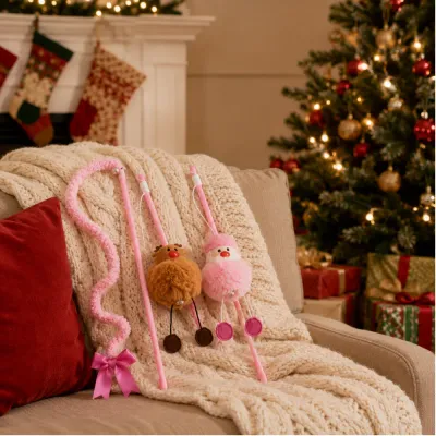 Christmas Cat Teaser Wands Holiday Display Christmas cat teaser wands displayed on a sofa beside a decorated Christmas tree and holiday gifts
