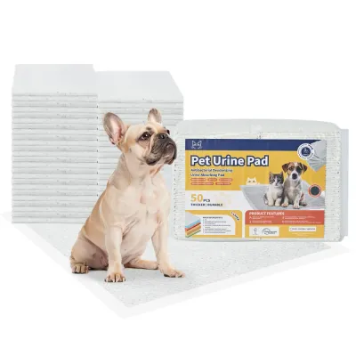 Stack of disposable puppy training pads with 50 count package and dog