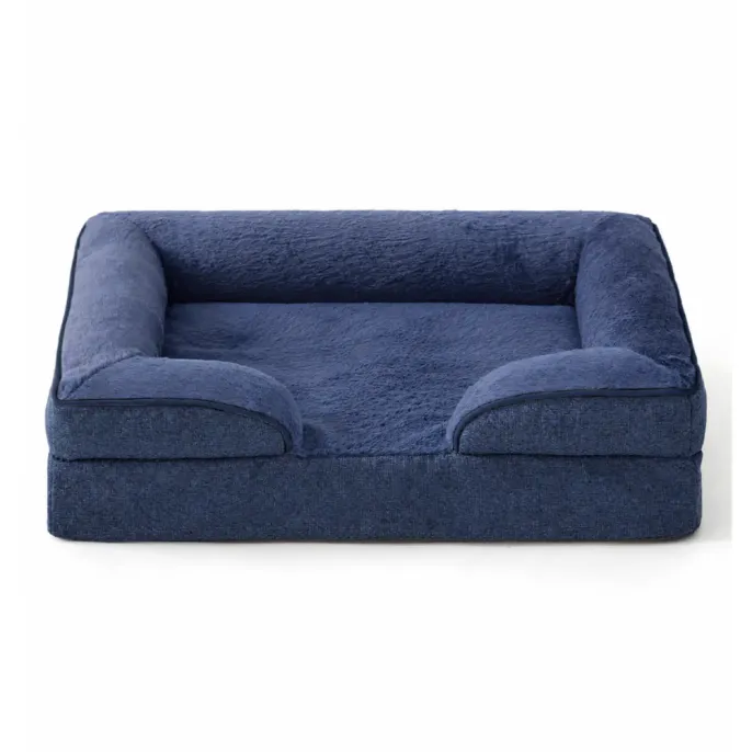 Navy blue orthopedic dog bed with soft plush sleeping surface and raised supportive bolsters