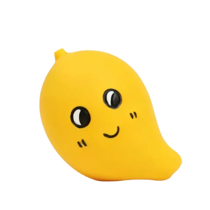 Yellow mango-shaped latex squeaky dog toy with cute cartoon face